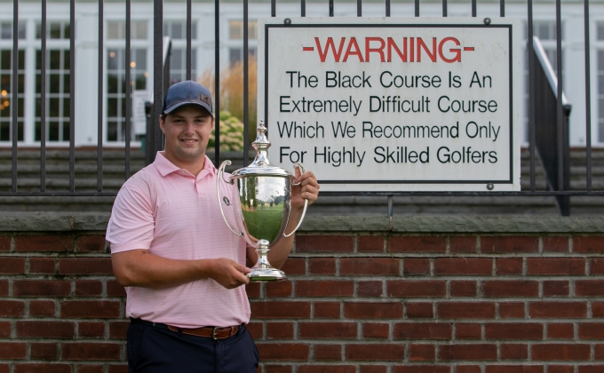 Jack Wall with the Met Am trophy and Bethpage Black Warning sign