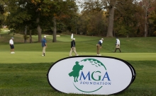 MGA Foundation Banner with golfers in the background
