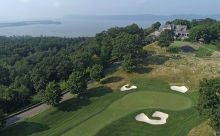 Aerial view of Hudson National Golf Club's 18th green and clubhouse